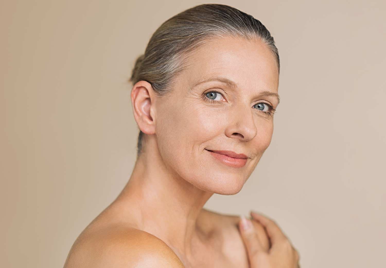 Woman showing the results of a natural facelift
