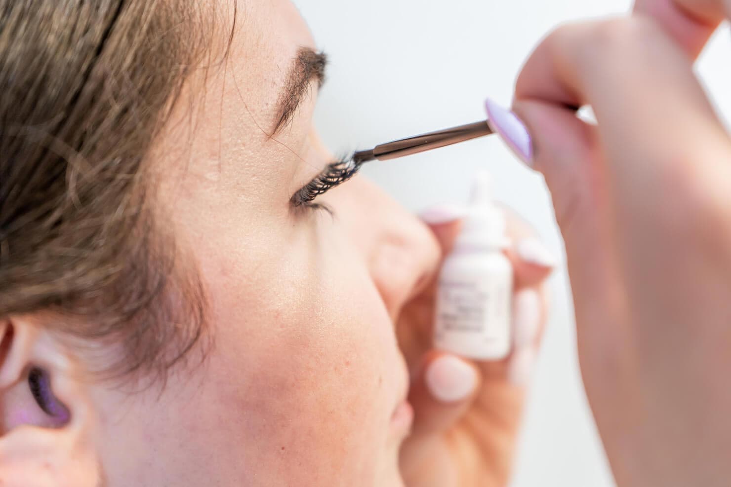Applying LATISSE with the sterile applicator brush