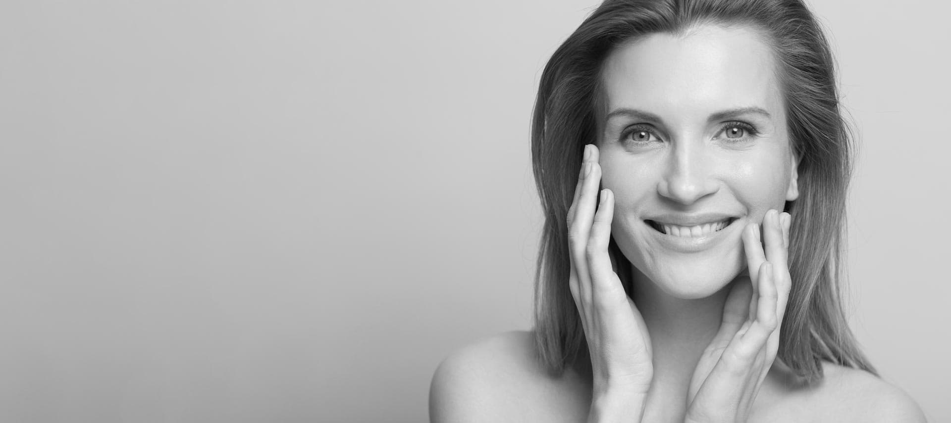 Middle-aged woman with rejuvenated facial volume